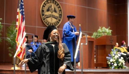 Graduate walking off stage