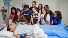 Students learning to check a heart at the clinic