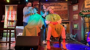 CCOM students get their heads shaved to support cancer research.