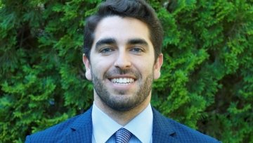 David Sutter Headshot in blue suit.