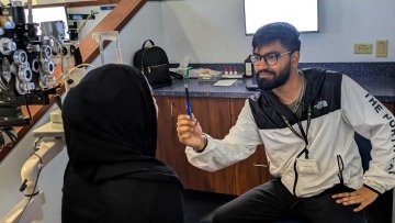 Students practice the NPC test with a pen.