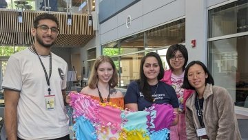 Pharmacy students make no-sew blankets and display their handiwork.