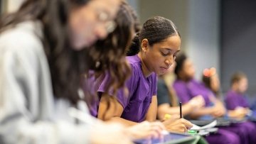 Veterinary Medicine lecture hall with students taking notes