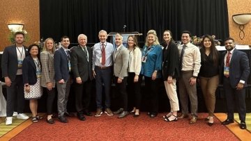 Faculty and students from the College of Dental Medicine-Illinois take a photo at the IL State Dental Society Annual Meeting.