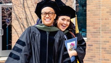 Graduates smiling.