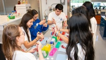 High school students mixing medicine.