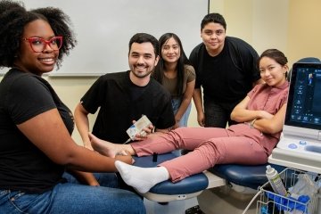 Arizona high school students participating in a hands-on podiatry demonstration at Midwestern University.