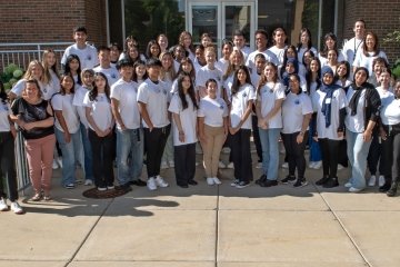 High school students and college mentors in a group photo at PharmAcademy.