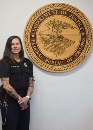 PA alum Cynthia Pokluda in uniform at the Federal Bureau of Prisons. 