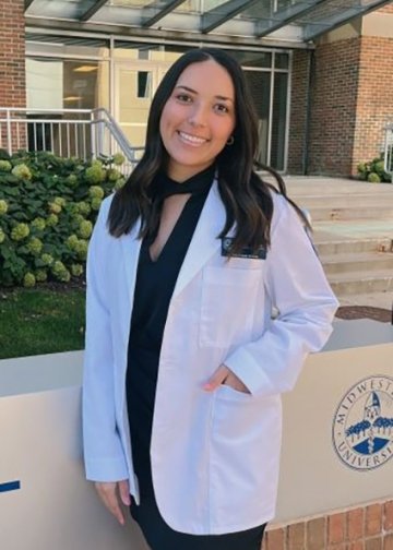 Profile photo of Occupational Therapy student Mckenzie Pflaum in a white coat.