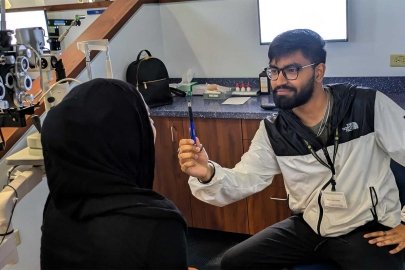 Students practice the NPC test with a pen.