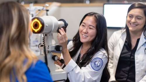 Faculty and students in optometry lab