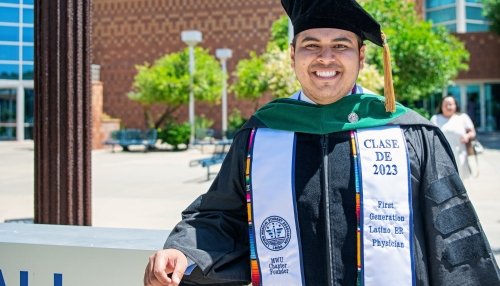 Midwestern University Osteopathic Medicine student poses after commencement ceremony.