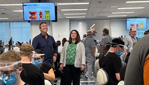 Kelly Lempicki poses in the simulation lab with College Tour host, Alex.