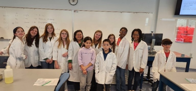 Dr. Sigar with the children participating in the Getting to Know the Real Laboratory program.