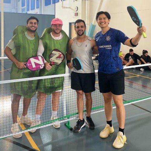 Pickleball tournament winners gather for a photo.