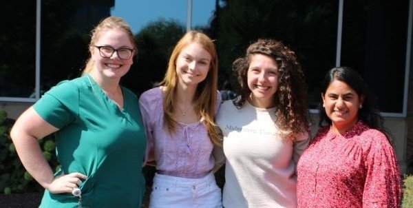 Members of the Precision Medicine Club pause for a photo at the fair.